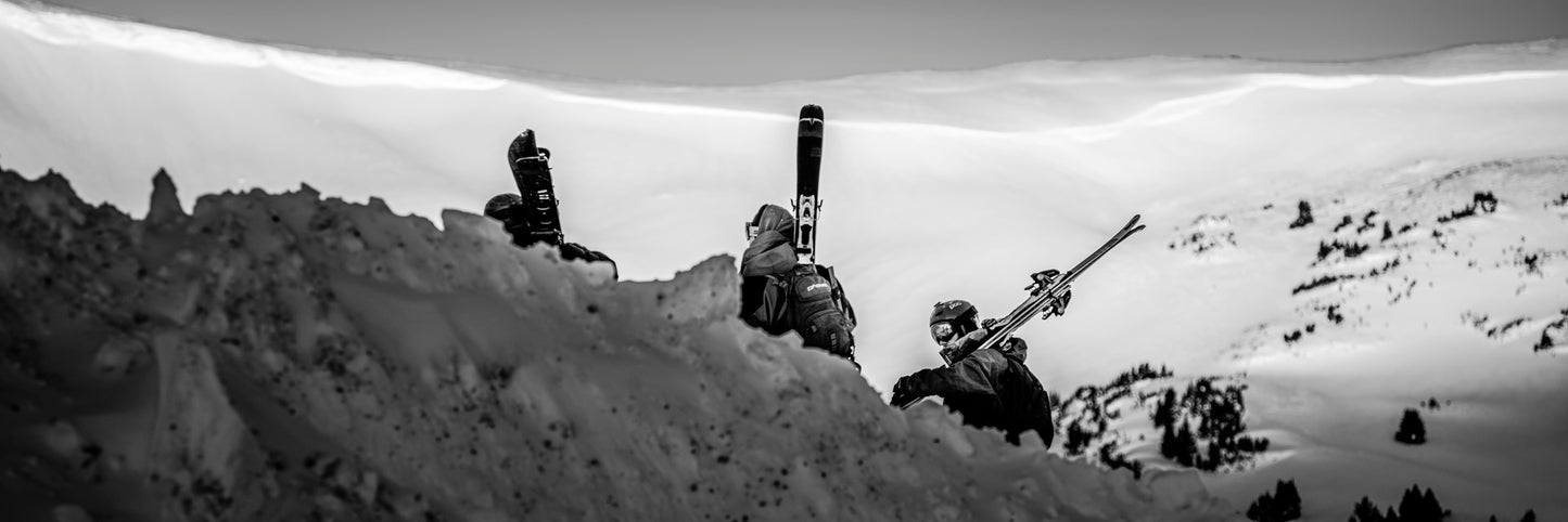 A black and white image of skiers heading into the backcountry on Loveland Pass inC Colorado - Limited Edition Fine Art Panorama Print by Alber Photography